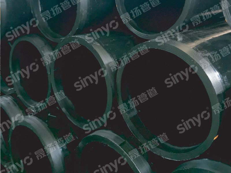 Heat-resistant polyethylene composite pipe with perforated steel mesh