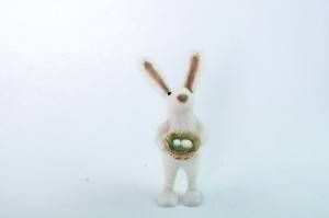 Cute Easter bunny with eggs in forest