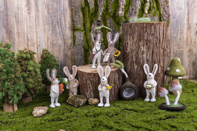 Cute Easter bunny with eggs in forest Featured Image