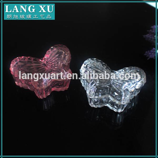 spraying glass butterfly shaped glass jar with lid