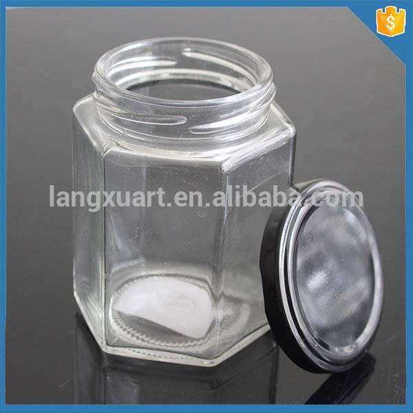 LXXZ-G030 280ml honey jam use oval hexagon glass jar with metal lid