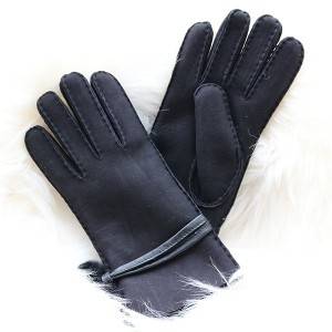 Ladies handsewn double faced shearling gloves feature leather belt