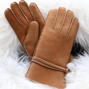 Ladies handsewn double faced shearling gloves feature leather belt