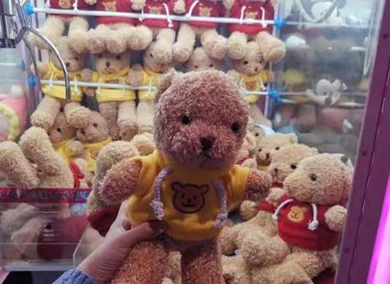 Why are the claw doll machines so popular?