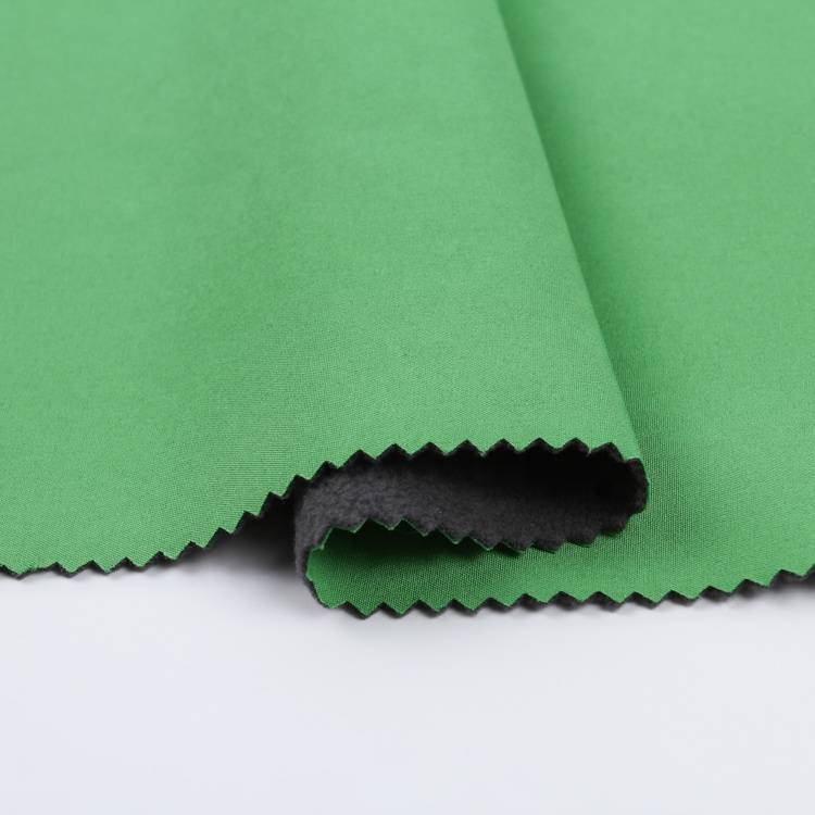 Four way stretch polyester spandex fabric bonded with weft knit softshell fabric